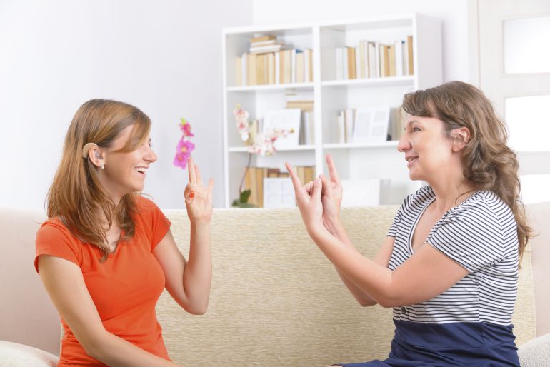 A deaf person is able to communicate with sign language, and people with prelingual hearing loss are also capable of developing speech with the aid of a speech therapist. 